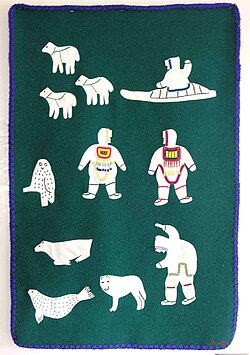 Indigenous peoples textile art in 1995 by Julia Pingushat, including Inuk, Arviat, Nunavut, Canada, wool, and embroidery floss
