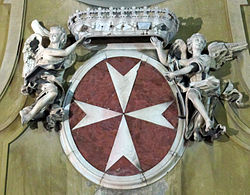 Emblem of the Military Order of Malta on the façade of San Giovannino dei Cavalieri, Florence (1699).