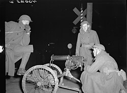 National Guardsmen with machine guns overlooking Chevrolet factories number nine and number four
