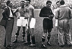 From left to right: Italian manager Pozzo, Monzeglio, Bertolini, the goalkeeper and captain Combi, Monti (half-hidden) and the assistant manager Carcano (behind) before the start of extra time in the victorious final versus Czechoslovakia