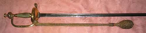 German cavalry officers' Stichdegen (dress sword, literally 'stabbing rapier') with sword knot, or Troddel. When worn, the sword knot is wrapped around the sword guard, or sometimes looped though a slot in the guard.