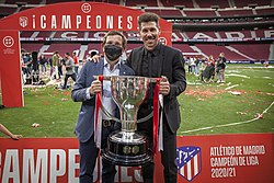 Simeone posing with the La Liga trophy in 2021