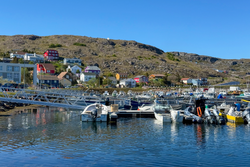 Fishing boats in Saint Pierre Harbour below the northeastern quarter of the village