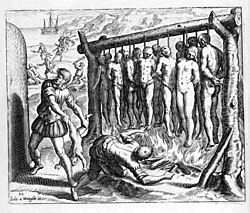Theodor de Bry illustration depicting Spanish atrocities during the conquest of Hispaniola. Las Casas wrote about the cruelty of Spanish settlers: "They erected certain Gibbets, large, but low made, so that their feet almost reached the ground, every one of which was so ordered as to bear Thirteen Persons in Honour and Reverence (as they said blasphemously) of our Redeemer and his Twelve Apostles, under which they made a Fire to burn them to Ashes whilst hanging on them"[15]