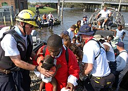 Rescue teams evacuating residents from flooded areas on August 30