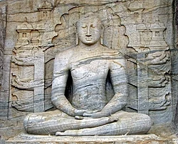 The seated image of Gal Vihara in Polonnaruwa, 12th century, which depicts the dhyana mudra, shows signs of Mahayana influence.