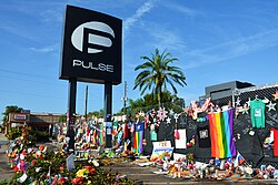 Memorials to the victims of the Orlando nightclub shooting left on the fence of the Pulse nightclub in Orlando in 2016