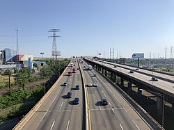 Northbound view along the western and eastern spurs of the turnpike as they rise to cross the Passaic River, as seen from the Pulaski Skyway