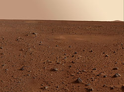 view of Martian desert showing rock field to the horizon