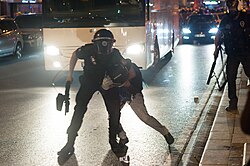 A General Directorate of Security riot control officer using force on a protester during the Gezi Park protests in Turkey