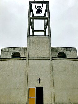 Facade and bell tower of Ignazio Gardella's church at the rehabilitation unit "Borsalino"