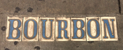 Street name done with tiles in the sidewalk