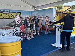 Fans take a photo with cardboard cutouts of the Impractical Jokers at the 2024 Toyota/Save Mart 350 in Sonoma, California.