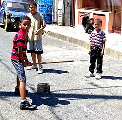 Plaquita, a Dominican street version of cricket. The Dominican Republic was first introduced to cricket through mid-18th century British contact,[91] but switched to baseball after the 1916 American occupation.[92]