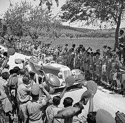 King George VI rides past cheering Indian troops, on his way to award Sepoy Kamal Ram the Victoria Cross, Italy, 26 July 1944