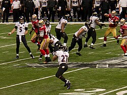 Baltimore Ravens quarterback Joe Flacco attempts a pass to Ray Rice.