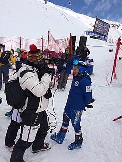 Eurosport staff conducting an interview at the 2015 Winter Universiade's Alpine skiing event.
