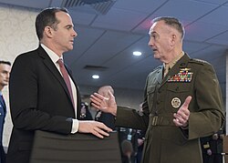 Marine Corps Gen. Joseph F. Dunford, Jr., chairman of the Joint Chiefs of Staff, speaks to special envoy for the Global Coalition to Counter the Islamic State of Iraq and the Levant, Brett H. McGurk, during the 2017 Chiefs of Defense Conference at Fort Belvoir, Va., Oct 24, 2017