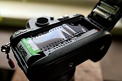 Nikon F100 analog camera during loading of 35mm film