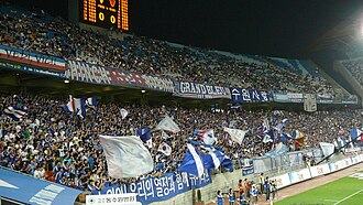 The Frente Tricolor supporters' group, formerly known as Grand Bleu, at the Suwon World Cup Stadium
