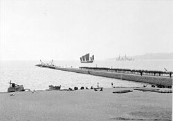 Pier with German naval personnel, apparent expansion in progress, 1898