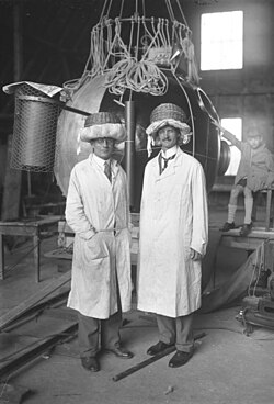 Auguste Piccard and Paul Kipfer, wearing improvised crash helmets, September 1930