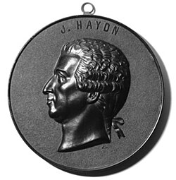 A decorative medal made in France in the early 20th century moulded from shellac compound, the same used for phonograph records of the period