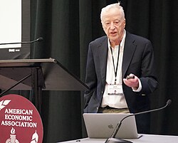 Akerlof speaking at AEA 2025
