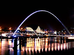 Gateshead Quays across the River Tyne at night – Gateshead Millennium Bridge and behind it The Glasshouse