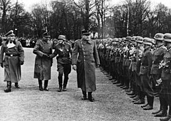 Vidkun Quisling (far right) and Jonas Lie inspect the Norwegian Legion