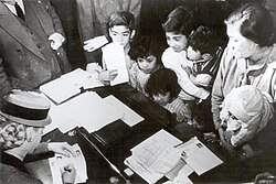 First Lady Eva Perón (left) tending to the needy in her capacity as head of her foundation