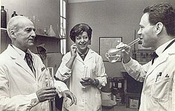 Luis Federico Leloir (left) and his staff toast his 1970 Nobel Prize in Chemistry.