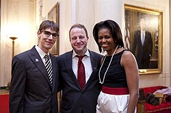 Polis (center) with his future husband[143] Marlon Reis (left), and First Lady Michelle Obama at the White House, circa 2014