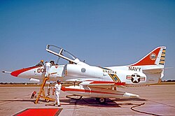 TA-4J Skyhawk flown by the Commander Naval Air Training Command CNATRA. The red carpet has been rolled out for him at Randolph AFB, Texas, in 1975