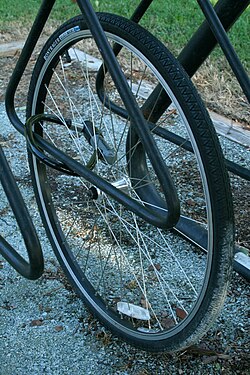 A bicycle wheel remains chained in a bike rack after the rest of the bicycle has been stolen at east campus of Duke University in Durham, North Carolina.