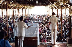 American pastor Johannes Maas preaching in Andhra Pradesh, India in 1974. Spreading the revival is an essential part of work done by evangelical missionaries.