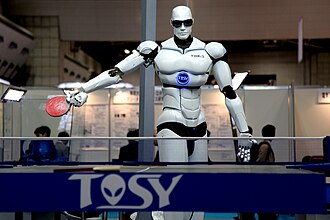 TOPIO, a ping pong–playing robot