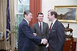 Photo of Biden shaking hands with Reagan in the Oval Office
