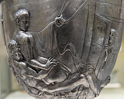 A man spies on two males having intercourse in side A of the Warren Cup