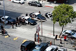 Los Angeles Police Department officers arresting suspects during a traffic stop