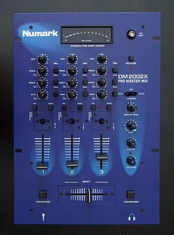 A Numark DM2002X Pro Master DJ mixer. This three-channel mixer can have up to three input sound sources. The gain control knobs and equalization control knobs allow the volume and tone of each sound source to be adjusted. The vertical faders allow for further adjustment of the volume of each sound source. The horizontally-mounted crossfader enables the DJ to smoothly transition from a song on one sound source to a song from a different sound source.