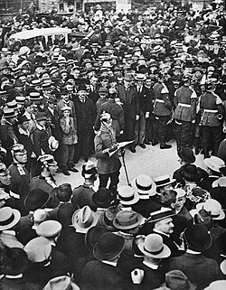 A Berlin crowd listens as a German officer reads Wilhelm II's order for mobilisation, 1 August 1914.