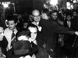 Bettino Craxi, viewed by many as the symbol of Tangentopoli, Leader of the Socialist Party and Prime Minister from 1983 to 1987, is greeted by a salvo of coins as a sign of loathing by protesters.