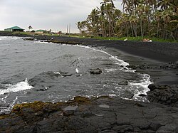 Punaluʻu Beach, on the Big Island features black volcanic sand.