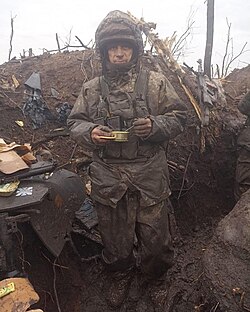 Ukrainian soldier in a trench during the Battle of Bakhmut