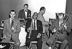 November 1947--Bill Reinhardt (clarinet), Danny Alvin (drums), Bechet (soprano sax), Mel Grant (piano), and Munn Ware (trombone).