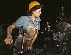 A turret-lathe operator machining parts for transport planes at the Consolidated Aircraft Corporation plant, Fort Worth, Texas, USA, in the 1940s