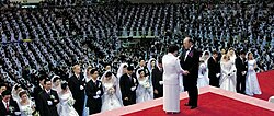 Mass wedding ceremony conducted by Han and Moon.