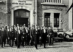 President Mustafa Kemal Atatürk (center) and Prime Minister İsmet İnönü (left) leaving the Grand National Assembly of Türkiye during the 7th anniversary celebrations of the Turkish Republic in 1930