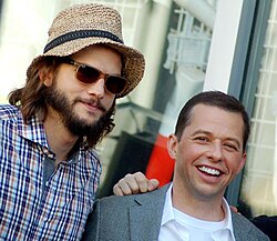 Kutcher (left) with Two and a Half Men co-star Jon Cryer in September 2011